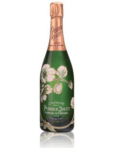 a bottle of champagne with white flowers on the label and gold cap, in front of a white background