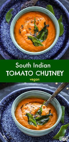 two bowls filled with tomato soup and garnished with basil leaves on the side