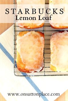 four lemon loafs sitting on top of a cooling rack