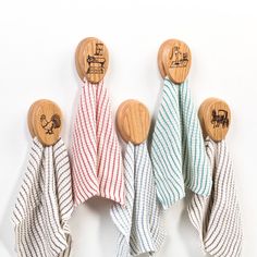 three wooden spoons and two striped towels