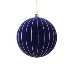 a blue ornament hanging on a white background