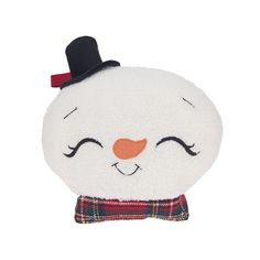 a white stuffed animal with a black top hat and plaid scarf on it's head