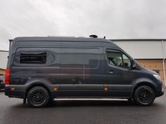 a van is parked in front of a building