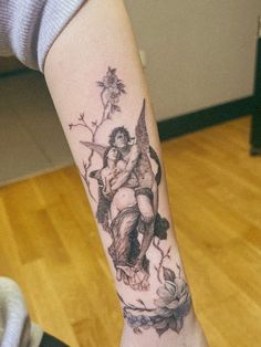 a woman with a tattoo on her arm