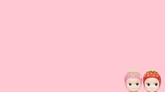 two little dolls are standing next to each other on a pink background with the same color