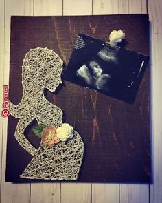 an image of a woman's silhouette with flowers on it and a photo of her baby