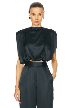 Find THE SEI Gathered Shoulder Top In Black on Editorialist. The Sei Gathered Shoulder Top in Black 100% silk. Made in USA. Dry clean only. Item not sold as a set. TSEX-WS65. Ts2011. About the designer: THE SEI is a luxury ready-to-wear collection based in L.A. and founded in 2020 by an all-female team of diverse individuals. With prior experience working together at Michelle Mason, the team set out on their own venture where THE SEI was born. The brand sets out to create thoughtful pieces, designed for women—by women, expanding beyond a range of generations and lifestyles. THE SEI aims to build a foundation of polished classics mixed with seductive silhouettes inspired to empower women to feel at their most confident and balanced self, while remaining effortless and timeless. Foundation Brands, Michelle Mason, Crepe Top, Pleat Top, Halter Neck Top, Empower Women, Satin Top, One Shoulder Tops, Donna Karan