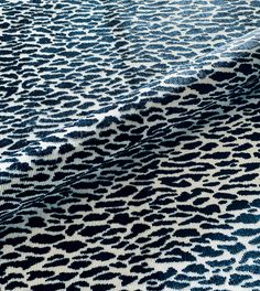 a blue and white animal print fabric