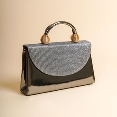 The sides and chain strap of this wedding clutch bag made of faux leather and glitter fabric are silver colored. Basic make-up supplies, cell phone, key chain, credit card and money can easily fit into this luxury mini bag. The interior of this evening bag has a single compartment and is lined with suede. It has a 120 cm removable chain strap. This wedding clutch is completely handmade. Features: Faux leather and glitter fabric. Fits basic makeup, cell phone, key chain, credit card and money. Su Silver Top Handle Satchel For Party, Event Tote Bag With Detachable Handle, Silver Shoulder Box Bag For Party, Silver Evening Bag With Top Carry Handle, Party Tote Evening Bag With Detachable Handle, Party Tote Shoulder Bag With Adjustable Handle, Party Tote Bag With Adjustable Handle, Formal Rectangular Gift Bag, Elegant Satchel Box Bag For Party