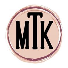 a pink circle with the letter tk in black on it's bottom half