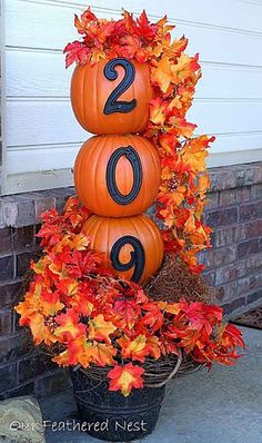 three pumpkins are stacked on top of each other