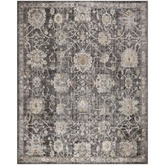 an area rug with grey and white flowers on the bottom, in front of a gray background