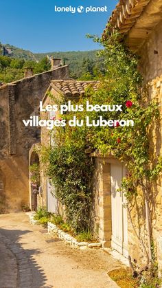 the cover of le plus beaux village du luberon, with an old building in the background