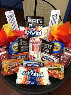 a basket filled with candy and snacks on top of a table