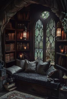 a living room filled with lots of furniture and bookshelves next to a window