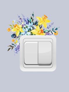 a white light switch with colorful flowers on it