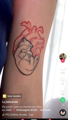 an image of a tattoo on someone's arm that has a heart in it