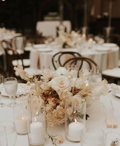 the table is set with candles and flowers