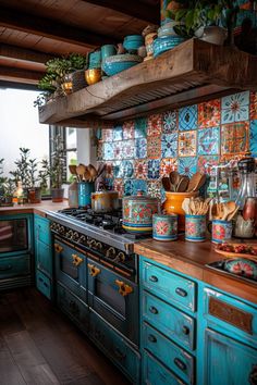 a kitchen with blue cabinets and colorful tiles on the backsplash, potted plants