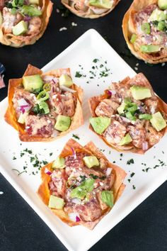 small appetizers with meat and vegetables on a white plate