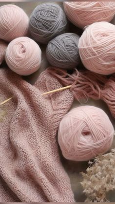 several skeins of yarn sitting next to each other on top of a table