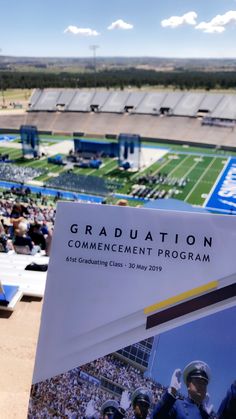 an aerial view of a football stadium with the words graduation commencement program written on it