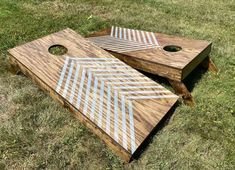 two wooden boards sitting on top of grass