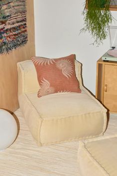 a chair and ottoman in a room