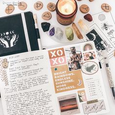 the contents of a planner spread out on a table with pens, rocks and candles