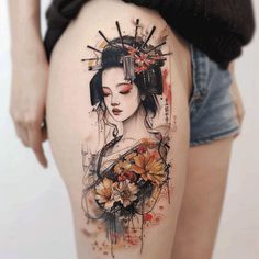 a woman's thigh with an artistic tattoo design on her thighs and the image of a geisha holding flowers