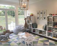 a living room filled with lots of furniture and decor on top of a checkered floor