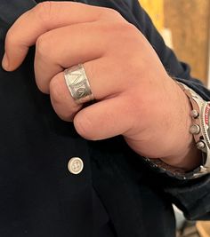 a close up of a person wearing a ring