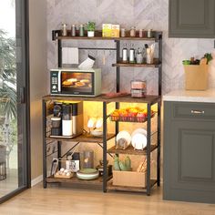 a kitchen area with a microwave, toaster oven and various items on the shelves