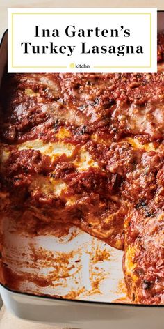 a casserole dish filled with meat and cheese in a white pan, with the words ina garten's turkey lasagna above it