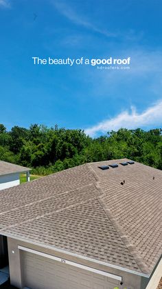 the roof of a house with trees in the background and blue sky above it that says, the beauty of a good roof