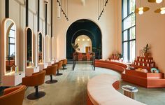 the inside of a salon with lots of chairs