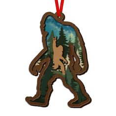 a wooden ornament with an image of a bigfoot