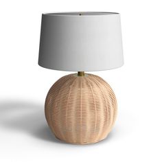 a wicker lamp with a white shade on the base and a light bulb at the end