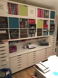 an organized office with lots of craft supplies