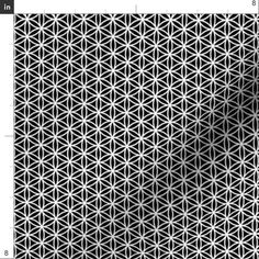 a black and white geometric pattern that is very similar to the shape of a flower