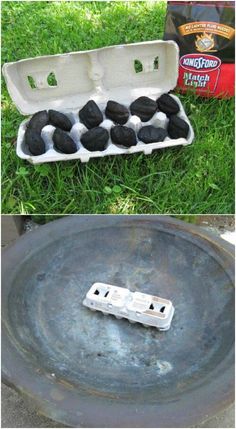 an egg carton filled with black rocks sitting on top of a grass covered field