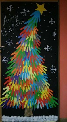 a christmas tree made out of colored crayons