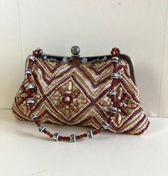 Vintage Beaded Handbag Chain Shoulder Strap Brown Ethnic Boho Crossbody  No Brand Label Height 15cm Width 24cm Top Handle and long crossbody chain strap Good Condition. Bohemian Beaded Clutch For Festivals, Bohemian Beaded Clutch, Festival Beaded Beige Bags, Beaded Beige Bags For Festivals, Bohemian Beaded Festival Clutch, Bohemian Rectangular Bag With Colorful Beads, Beige Beaded Festival Bags, Bohemian Embellished Shoulder Bag As Gift, Bohemian Embellished Shoulder Bag For Gift