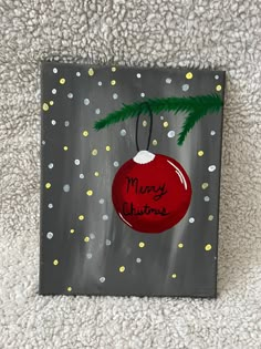 an acrylic christmas ornament on a canvas