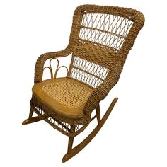 a brown wicker rocking chair on a white background