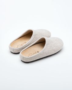 Description: The Nebraska Women's Wool Clog is an Italian take on a European classic. The women's Nebraska in beige is one of the most versatile mule style slippers available. From home to the office to weekend, the minimalist design of these clogs will take you anywhere in comfort. The anatomical self-molding latex and thermoforming cork insole provide firm customized comfort, and the insole is completely removable. LeClare Slippers are exclusively handcrafted in our small-batch factory in Trev Everyday Slip-on Slippers With Removable Insole, Classic Slip-on Clogs With Textured Footbed, Comfortable Beige Clogs With Textured Footbed, Beige Comfortable Clogs With Cushioned Footbed, Classic Slip-on Slippers With Textured Footbed, Beige Slip-on Clogs With Leather Sole, Comfortable Beige Clogs With Cushioned Footbed, Beige Flat Clogs With Cushioned Footbed, Beige Clogs With Textured Footbed And Flat Heel