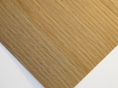 a close up view of wood grains on a white surface with light brown tones