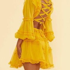 Yellow Skater Style Dress. With Deep V Front, Mid Section Cutout, Lace Up Back. The Length Is Mid Thigh. Dress Is Lace And Sheer. Very Trendy Fit And Flare Mini Dress, Model Profile, Tie Up Dress, Skater Style Dress, Yellow Fits, Flare Mini Dress, Chiffon Long Sleeve, Yellow Shorts, Lace Back