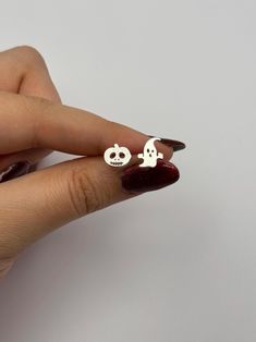 👻 🎃Get into the spooky spirit with our Halloween Spooky Ghost/Pumpkin Earrings! These adorable 925 sterling silver stud earrings feature tiny ghost and pumpkin designs, perfect for adding a festive touch to your fall and Halloween jewelry collection. Whether you're dressing up for a Halloween party or simply looking for a fun, seasonal accessory, these earrings are the perfect choice. Choose your own Spooky Style! You can choose pumpkin and/or ghost. Choose your pair!  Crafted from high-quality sterling silver, they are durable and comfortable for everyday wear. These cute and spooky earrings make an excellent Halloween party gift for friends or a fun treat for yourself. Celebrate the season in style with these charming ghost and pumpkin earrings! 👻🎃 Halloween Themed Silver Earrings, Silver Themed Earrings For Halloween, Themed Silver Earrings For Halloween, Silver Spooky Halloween Earrings, Spooky Hypoallergenic Jewelry For Halloween, Cute Hypoallergenic Halloween Earrings, Spooky Nickel-free Earrings For Halloween, Tiny Ghost, Halloween Party Gifts