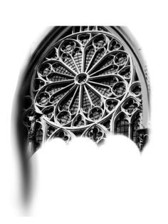 a black and white photo of an ornate window